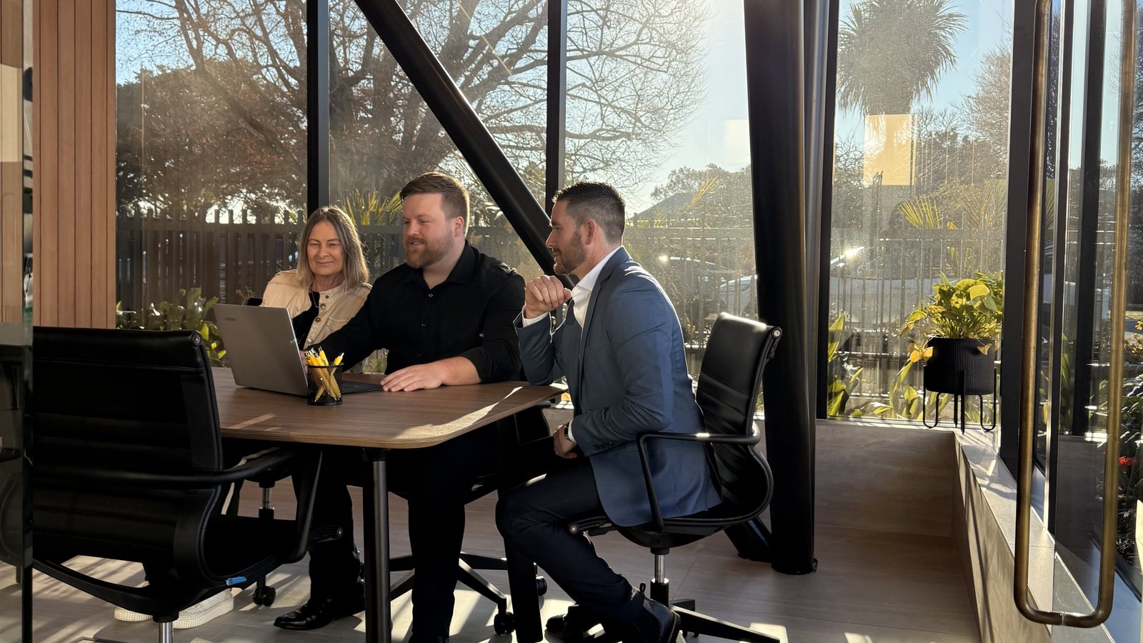 Ray White Nexus property managers going through a rental with an owner at the Hamilton office